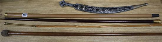 Two gold plate mounted walking canes, a bailiffs knocker walking cane and a gold plated riding crop